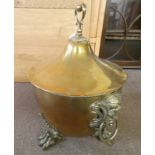 19TH CENTURY BRASS LIDDED COAL BIN WITH DECORATIVE MASK HANDLES ON PAW FEET,