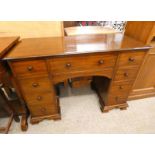 19TH CENTURY MAHOGANY KNEE HOLE DESK WITH CENTRALLY SET DRAWER FLANKED BY 2 SETS OF 4 DRAWERS.