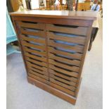 MAHOGANY FILING CHEST WITH MULTI-DRAWER INTERIOR BEHIND TAMBOUR DOOR ON PLINTH BASE LABELLED MAN