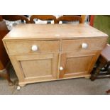 PINE CHEST OF DRAWERS WITH 2 DRAWERS OVER 2 PANEL DOORS.