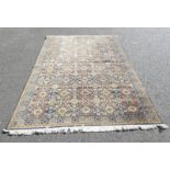 MIDDLE EASTERN CARPET WITH BLUE AND GOLD FLORAL PATTERN,