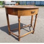 20TH CENTURY OAK HALFMOON SIDE TABLE WITH SINGLE DRAWER ON TURNED SUPPORTS,