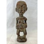 SEPIK RIVER FERTILITY FIGURE, CARVED WOODEN FORM WITH HANDS TO STOMACH,