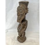 SENUFO FIGURE OF A MAN, CARVED WOODEN FORM WITH FLAT SECTION TO HEAD, LARGE BEARD ON CIRCULAR BASE,