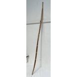 SELF BOW, 173 CM LONG WOOD BODY BOUND WITH BRASS WIRE AND A MOTHER OF PEARL INSERT.