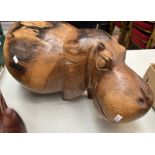 LARGE AND HEAVY WOOD SCULPTURE OF A HIPPO,