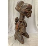 WEST AFRICAN CARVED WOODEN FIGURE OF A FEMALE WITH CHILD TO BACK,