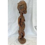 IGE AFRICAN STANDING 'BAULE' FIGURE, CARVED WOODEN FORM, HANDS TO STOMACH, 60.