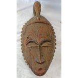 AFRICAN MASK WITH BIRD TO HEAD, PUCKERED MOUTH, WITH REMAINS OF PIGMENTATION TO FACE,