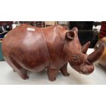 LARGE AND HEAVY WOOD SCULPTURE OF A RHINO WITH HORN,