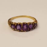 9CT GOLD 5- STONE AMETHYST SET RING -2.2 G Condition Report: Ring size: Q.