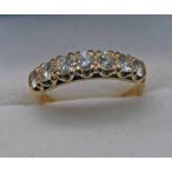 GOLD 7 - STONE DIAMOND SET RING, THE CENTRE STONE APPROX 0.