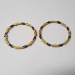 PAIR OF 18CT GOLD HINGED BANGLES WITH TWIST TEXTURED DECORATION - 14.