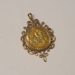 1914 HALF SOVEREIGN IN A 9CT GOLD PENDANT MOUNT - 7.