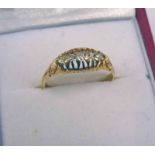 18 CARAT GOLD DIAMOND SET FIVE STONE RING