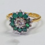 DIAMOND & EMERALD CLUSTER RING IN SETTING MARKED 18CT & PLAT Condition Report: