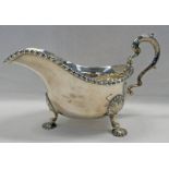 SILVER SAUCE BOAT WITH DECORATIVE BORDER & SHELL FEET,