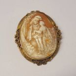 VICTORIAN GOLD CAMEO BROOCH OF A COUPLE IN A DECORATIVE MOUNT - 7CM LONG,