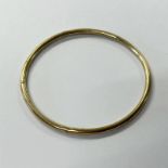 9CT GOLD SLAVE BANGLE - INNER DIAMETER 6.5CM, 19.1G Condition Report: Marks clear.