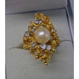 18CT GOLD PEARL & DIAMOND RING, THE CULTURED PEARL SET WITHIN A NEST STUDDED WITH DIAMONDS - 13.