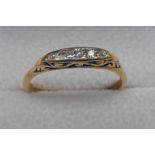 EARLY 20TH CENTURY 5 - STONE DIAMOND SET RING IN A YELLOW METAL MOUNT - 2.