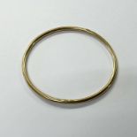 9CT GOLD SLAVE BANGLE - INNER DIAMETER 6.5 CM, 19.1 G Condition Report: Marks clear.