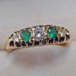 18CT GOLD EMERALD & DIAMOND 5-STONE RING IN A SCROLL MOUNT