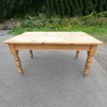 PINE KITCHEN TABLE ON TURNED SUPPORTS.