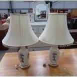 PAIR OF PORCELAIN TABLE LAMPS WITH FLORAL DECORATION & CIRCULAR METAL BASES.