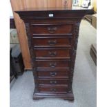 21ST CENTURY HARDWOOD 7 DRAWER WELLINGTON CHEST WITH DECORATIVE CARVING 136 CM TALL X 67 CM WIDE