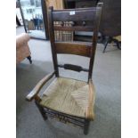 19TH CENTURY ELM LOW OPEN ARMCHAIR WITH ROPEWORK SEAT ON TURNED SUPPORTS
