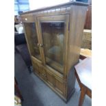 ERCOL ELM BOOKCASE WITH SHELVED INTERIOR BEHIND 2 GLAZED PANEL DOORS OVER 2 PANEL DOORS.