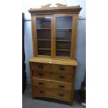 19TH CENTURY OAK BOOKCASE CHEST WITH SHELVED INTERIOR BEHIND 2 GLAZED PANEL DOORS OVER BASE OF 2