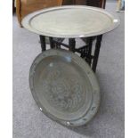 EASTERN STYLE BRASS CIRCULAR TRAY TABLE WITH ETCHED DECORATION ON FOLDING HARDWOOD STAND & BRASS