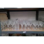 SUITE OF 3 SIZES OF WATERFORD CRYSTAL GLASSES & DECANTER ON ONE SHELF - **** SOLD PLUS VAT ON THE