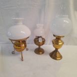 3 PARAFFIN LAMPS WITH WHITE GLASS SHADES OF VARIOUS DIFFERENT SIZES