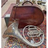 BOOSEY & CO FRENCH HORN WITH ITS LEATHER CARRY CASE.