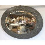 ARTS AND CRAFTS STYLE OVAL WALL MIRROR, DECORATED WITH FRUIT ON OUTER EDGE .