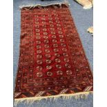 RED GROUND MIDDLE EASTERN RUG.