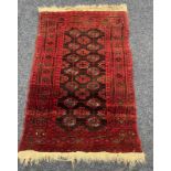 RED MIDDLE EASTERN RUG 105 X 71 CM