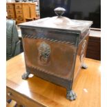 ART NOUVEAU STYLE COPPER LIDDED COAL BIN WITH EMBOSSED DECORATION ON PAW FEET,