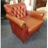 OVERSTUFFED RED LEATHER BUTTON BACK ARMCHAIR Condition Report: The lot has use