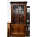 MAHOGANY CABINET WITH 2 ASTRAGAL GLASS DOORS OVER 2 PANEL DOORS ON PLINTH BASE,