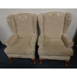 PAIR OF OVERSTUFFED WINGBACK ARMCHAIRS ON SHORT QUEEN-ANNE SUPPORTS