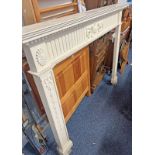 PAINTED FIRE SURROUND WITH CARVED DECORATION,