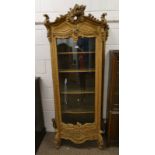 19TH CENTURY CARVED GILT DISPLAY CABINET WITH SHAPED GLAZED PANEL DOOR OPENING TO SHELVED INTERIOR