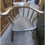 EARLY 20TH CENTURY CAPTAINS CHAIR ON TURNED SUPPORTS.