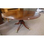 20TH CENTURY MAHOGANY OVAL FLIP TOP PEDESTAL BREAKFAST TABLE WITH 4 SPREADING SUPPORTS WITH BRASS