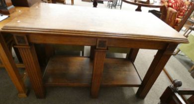 19TH CENTURY OAK ALTAR TABLE WITH UNDER SHELVES ON SQUARE REEDED SUPPORTS.