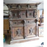 19TH CENTURY CARVED OAK COURT CUPBOARD WITH DECORATIVE FRIEZE OVER 3 PANEL DOORS WITH MASK